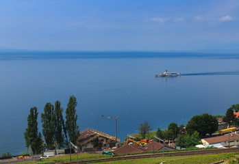 Fototapeta na wymiar Railway track on the vineyard, ship and blue lake