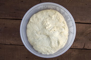 Kneading dough, fermented dough in a basin, dough for making bread

