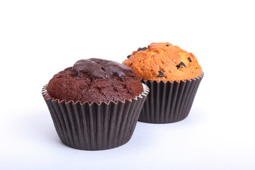 Fresh homemade muffins on white background. Top view.