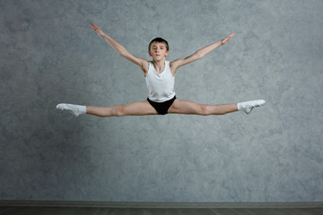 Little boy dancer in a dance studio