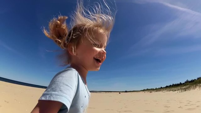 Little Girl Running Smiling Playing On Beach Slow Motion