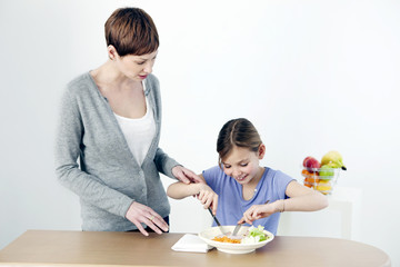 Obraz na płótnie Canvas Child eating a meal