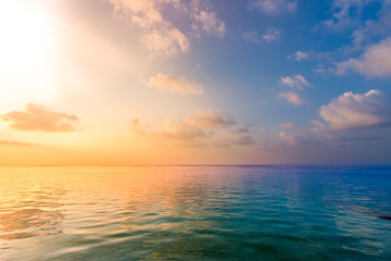 Fototapeta na wymiar Calm sea ocean blue sky background. Zen background, inspirational sky clouds background. Natural sunset, sea, background horizon, sea sunset view. 