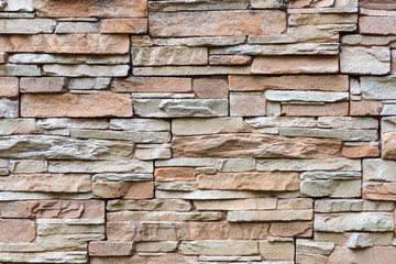 Texture of rough gray stone brick wall