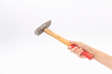 Female hands on a white background with a hammer.