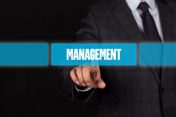 Hand pushing on a touch screen interface-MANAGEMENT button