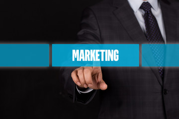 Hand pushing on a touch screen interface-MARKETING button