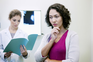 Doctor explaining to a patient the result of her mammogram