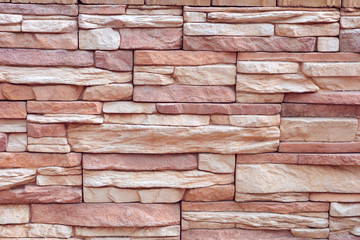 Texture of rough gray stone brick wall