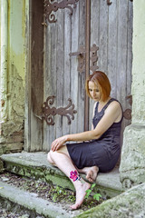 Girl in black sitting on the stairs