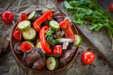  Cooked barbecue with vegetables.