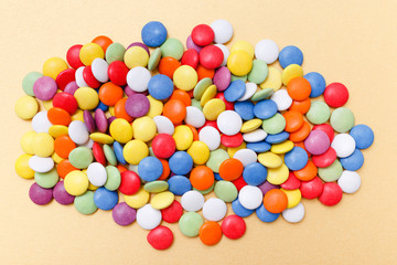 lollipops, candy, top view flat lay on yellow background