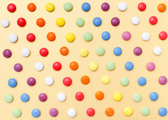 lollipops, candy, top view flat lay on yellow background