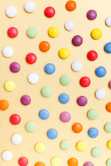 lollipops, candy, top view flat lay on yellow background