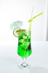 Lemonade tarhun or estragon with ice and lime on white background
