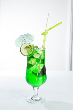 Lemonade tarhun or estragon with ice and lime on white background