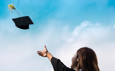 student graduate throw hat