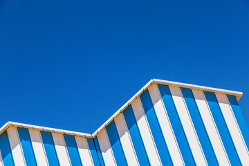 detail of cabin on a beach with blue sky on background