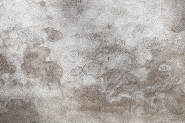 Naklejka premium Gray concrete wall with wet spots pattern