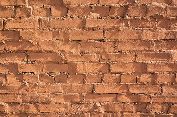 Grungy red brick wall, close-up background