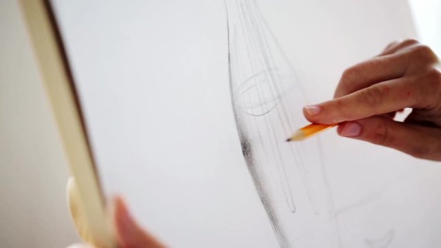 artist with pencil drawing still life on paper