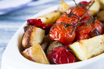 roasted vegetables in a ceramic pot. closeup view, selective focus