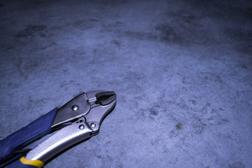 Locking Jaw Pliers On Concrete Floor