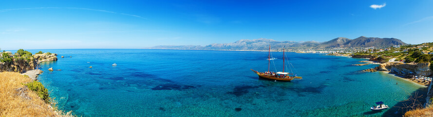 Panorama of beautiful scenery - traditional old fashioned cruise boat docked to the sand shore and...