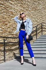 fashionable blonde model girl with handbag