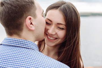Fototapeta premium kiss. Happy Smiling Couple in love