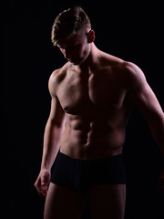 Fototapeta premium macho, muscular man with bare torso, six pack in underwear