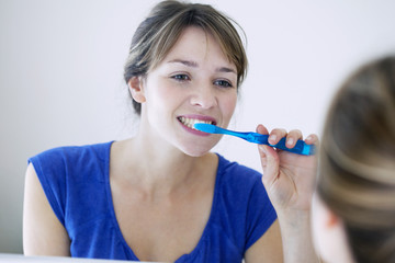 Woman brushing her teeth