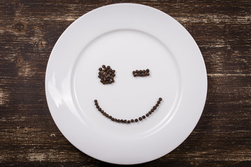 Happy smiley face on dish plate
