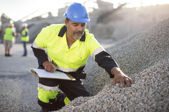 Quarry worker doing a quality check