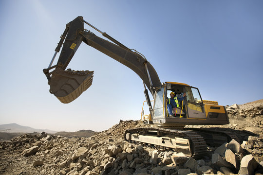 Digger working in quarry