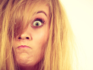 Naklejka premium Furiously mad angry blonde woman closeup