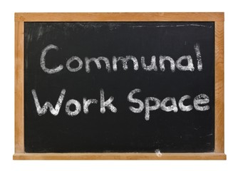 Obraz premium Communal Work Space written in white chalk on a black chalkboard isolated on white