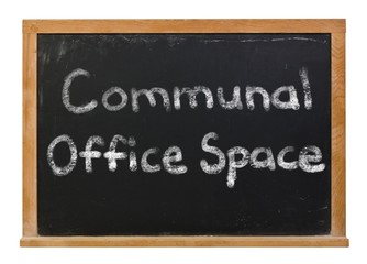 Obraz premium Communal Office Space written in white chalk on a black chalkboard isolated on white