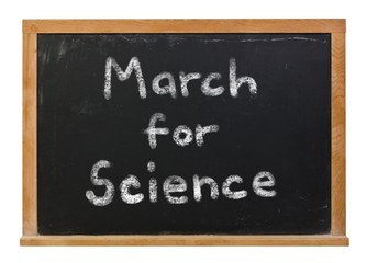 March for Science written in white chalk on a black chalkboard isolated on white