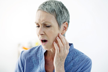 Elderly person with a toothache