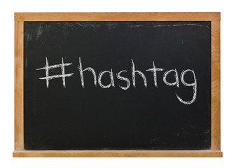 Obraz premium Hashtag written in white chalk on a black chalkboard isolated on white