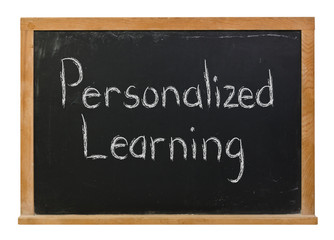 Obraz premium Personalized Learning written in white chalk on a black chalkboard isolated on white