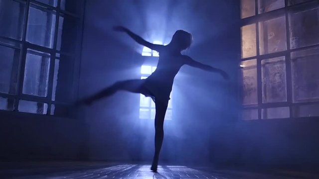 Girl teenage dance moonlight penetrates through window. Silhouette, slow motion