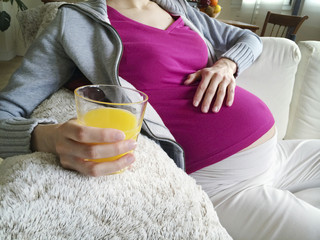 Pregnant woman with orange juice