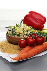 Tabbouleh salad with bulgur, parsley and vegetables -diet concep