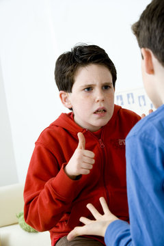 Models Do not use for HIV A young hearing-impaired boy and his brother using the French sign language to discuss with his brother The French sign language uses signs to designate words but also dactylology (each letter of the alphabet is represented by a defined position of the fingers then enabling to spell a word) and the lip reading The young boy designates the word \six\