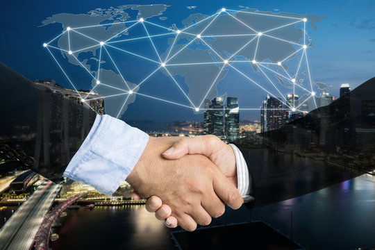 Deal or agreement business concept, handshake double exposure, cooperation or partnership business with global connection partnership map.