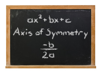 Obraz premium The quadratic formula and the axis of symmetry written in white chalk on a black chalkboard isolated on white