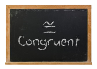 Obraz premium Congruent with it's symbol written in white chalk on a black chalkboard isolated on white