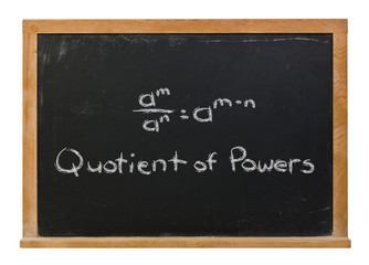 Quotient of Powers formula written in white chalk on a black chalkboard isolated on white